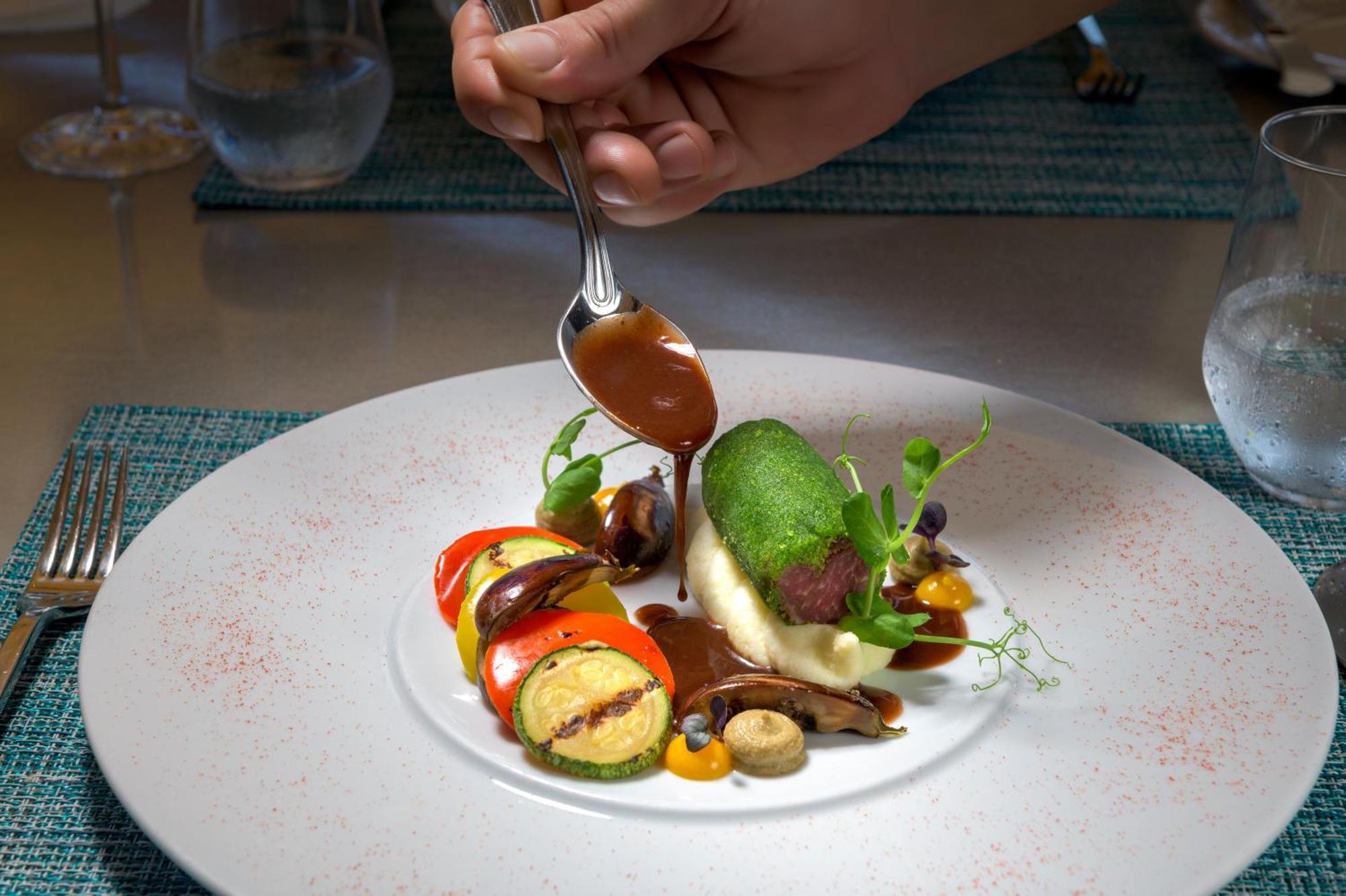 Rodos Palladium Leisure&Wellness Kallithéa Esterno foto A plate of food being garnished